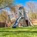 Jack and June Haven 2 Outdoor wooden playset with swing and slide, climbing ramp with rope and undercover landing. View of right front of playset in the garden