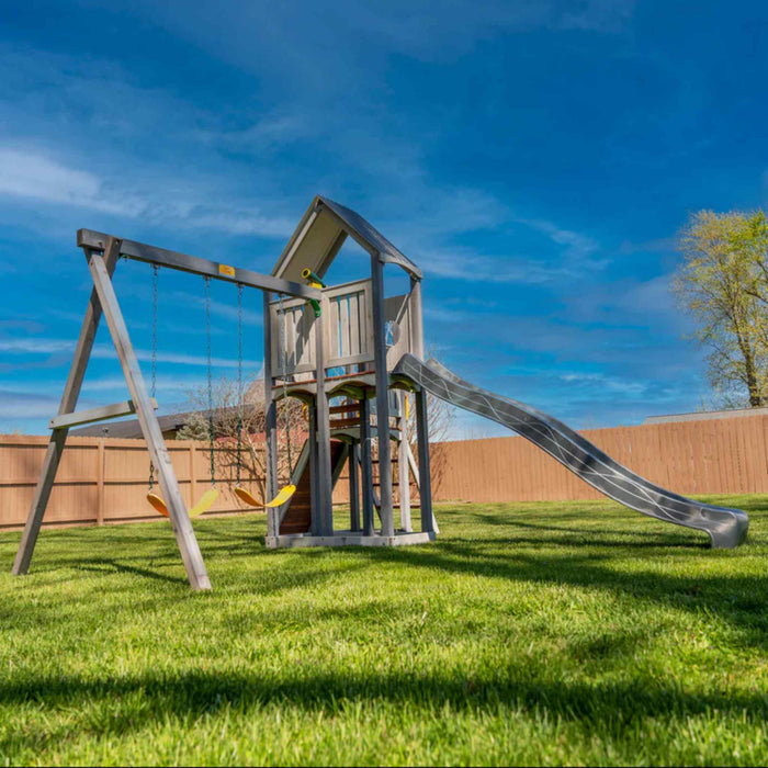 Jack and June Haven 2 Outdoor wooden playset with swing and slide, climbing ramp with rope and undercover landing. Level view of right of playset in the garden