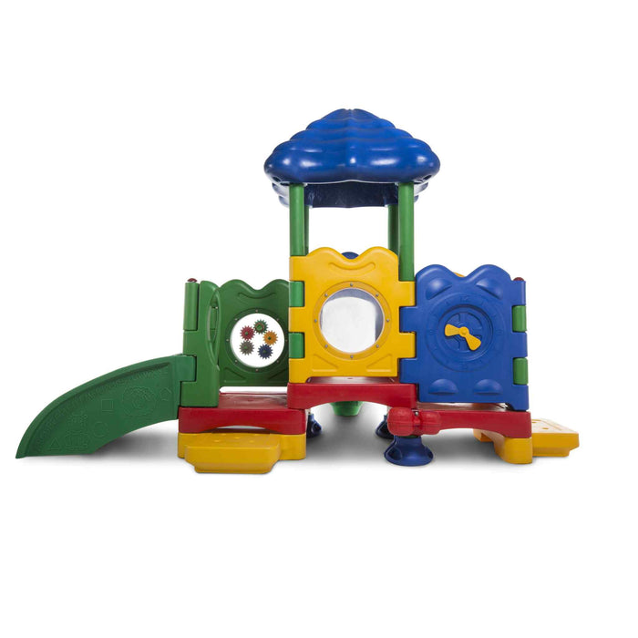 Ultraplay discovery center sapling toddler playset  side view displaying a green slide on the left yellow side board in the middle and blue square section on the right, blue roof, red base. Playset on a white back round