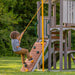 Jack and June Haven outdoor wooden playset with swings, slide, kid climbing the ramp holding onto a rope